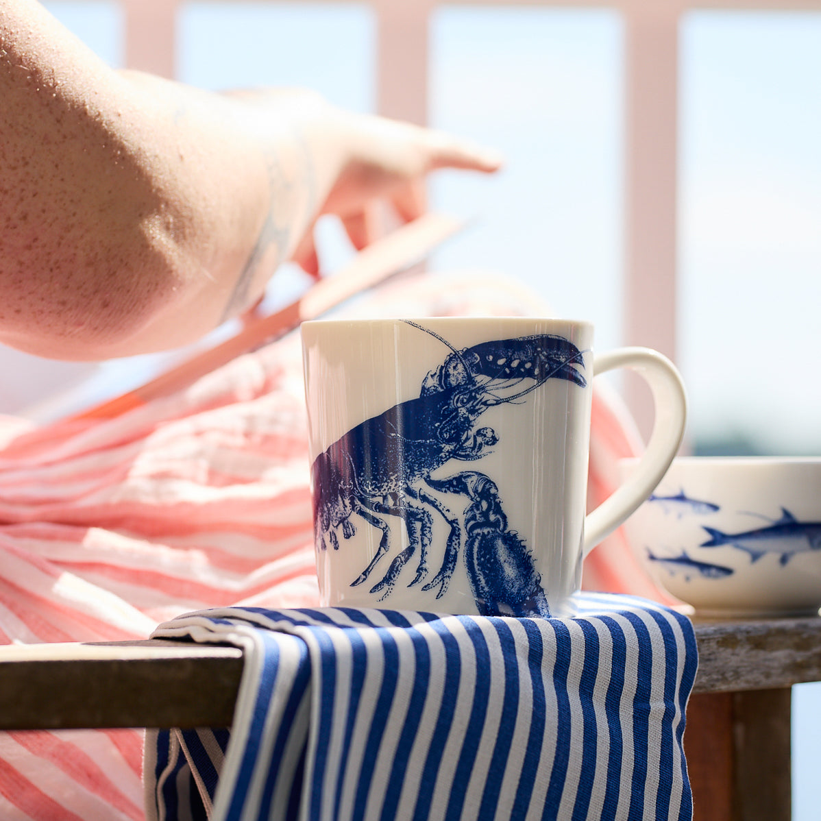 Lobster Mug by Caskata Artisanal Home featuring a blue illustration of a lobster on a plain background. Made in Sri Lanka with high-fired porcelain for durability and elegance.
