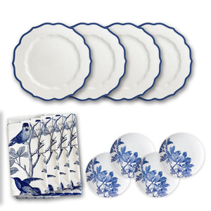 Part of the Caskata Blue Branches Luncheon Bundle, this set includes four white plates with blue scalloped edges and cloth napkins featuring bird and branch prints. It also comes with four small plates adorned with a charming blue leaf design, perfect for refreshing your spring table.