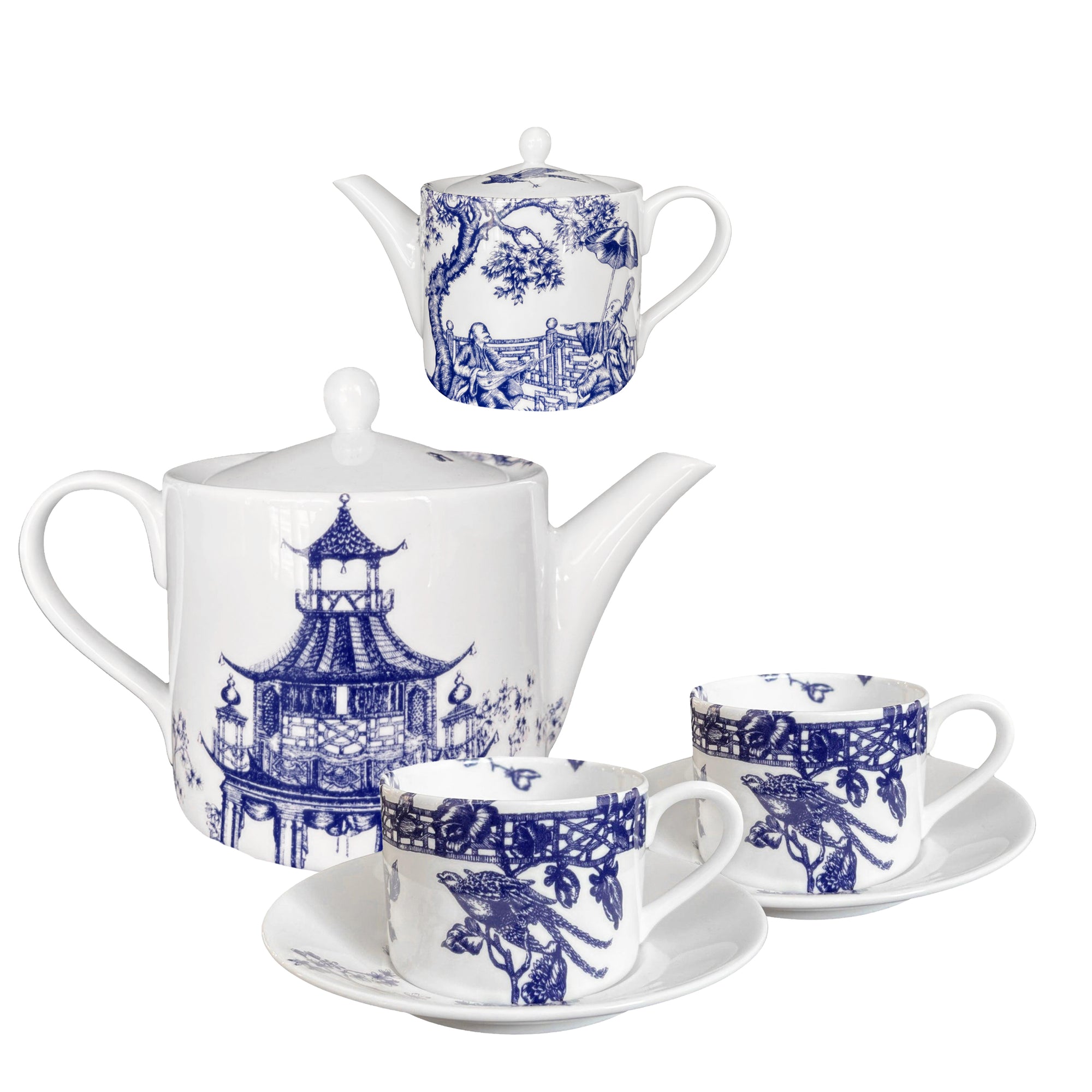 The Chinoiserie Tea Bundle by Caskata includes a white bone china teapot, creamer, two cups, and matching saucers with blue architectural and nature designs echoing Chinoiserie Toile elegance.