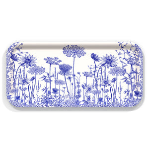 The Caskata Summer Blues Small Rectangular Birchwood Tray showcases detailed blue floral patterns on a white base, adding a summer touch to your gatherings.