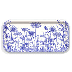 The Caskata Summer Blues Small Rectangular Birchwood Tray showcases detailed blue floral patterns on a white base, adding a summer touch to your gatherings.