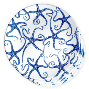 The Caskata Starfish Melamine Dinner Plates, Set of 4, showcase a vibrant blue octopus pattern on white melamine and are BPA-free for safe dining.