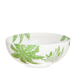 The Freya Vegetable Serving Bowl by Caskata Artisanal Home features an elegant green leaf pattern, making it perfect for any dining occasion.