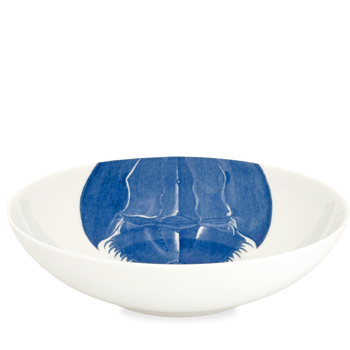 The Caskata Artisanal Home Horseshoe Crab Wide Serving Bowl showcases a blue illustration of a horseshoe crab on the interior base, crafted in high-fired porcelain.