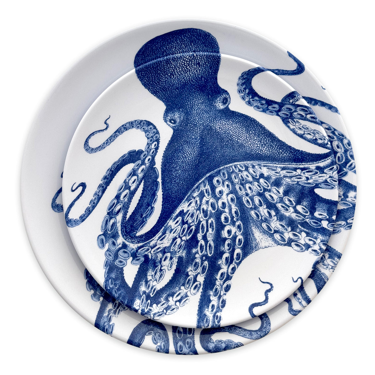 Two Caskata Lucy Melamine Salad Plates, part of a set of four, feature intricate blue octopus designs on white. Crafted from BPA-free melamine, they offer unbreakable elegance and peace of mind.