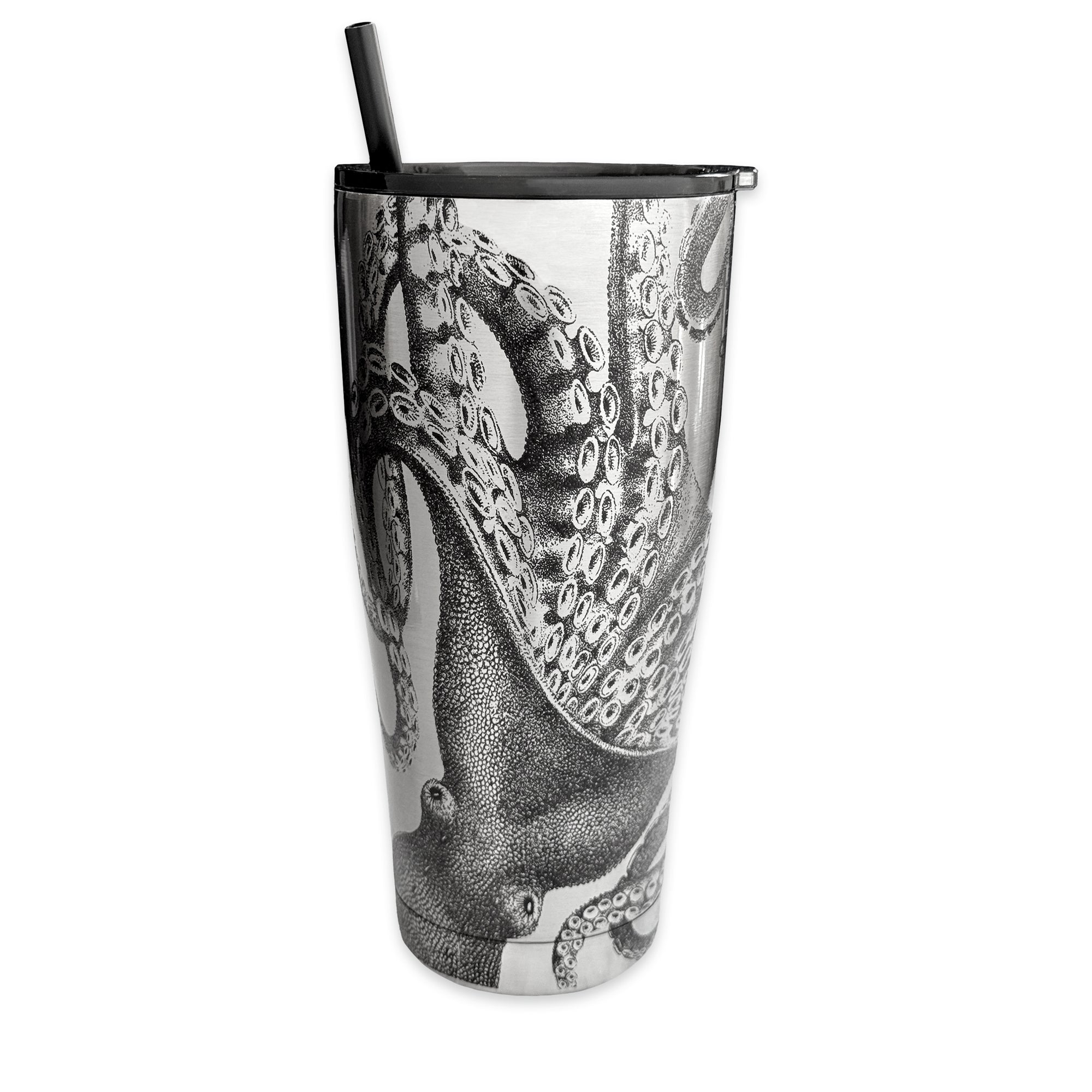 The Lucy Chrome Stainless Steel Insulated Tumbler by Caskata features a detailed black and white octopus illustration that gracefully wraps around its stainless steel surface, complete with a black straw.