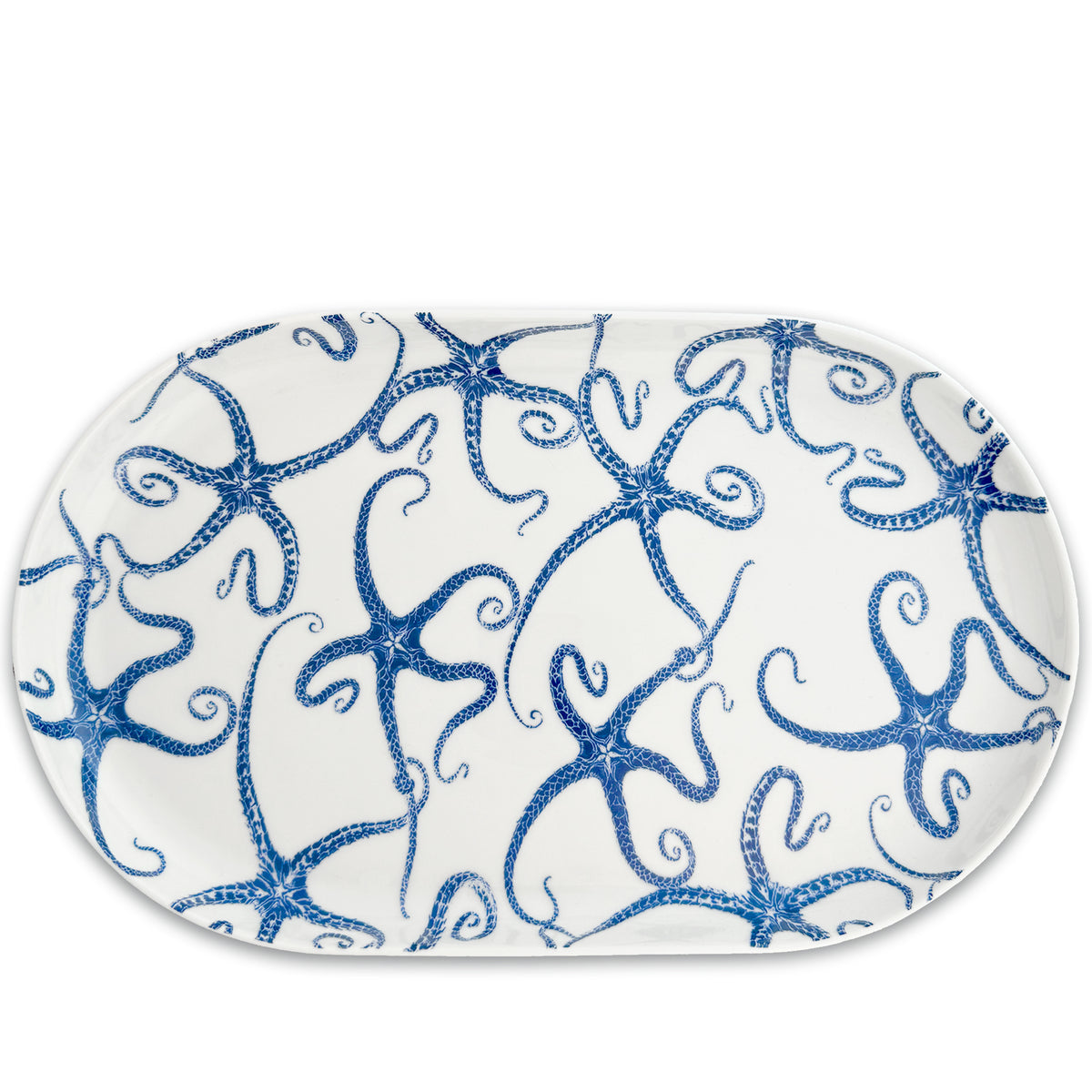 Introducing the Starfish Large Coupe Oval Platter by Caskata, a porcelain platter adorned with an enchanting blue octopus design on a pristine white background, ideal for enhancing your entertaining experience.