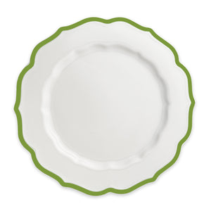 A top view of a white plate with a green scalloped rim from Caskata's Through the Garden Gate Dinner Bundle.